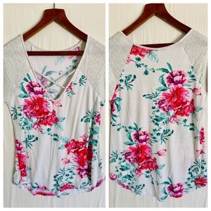 Floral top with cute details.